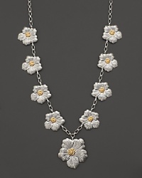 Delicate gardenias, captured at the height of their beauty in sterling silver and 18K yellow gold, bloom on this necklace from Buccellati.