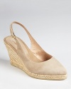 In soft suede, Andre Assous' Beth espadrille wedges are a timeless classic--available in two iconic colors.