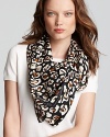 Echo's square scarf is spot on with its wild cheetah print and versatile size.