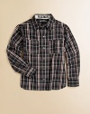 He'll look dapper wearing this long-sleeve shirt in classic plaid, with playful front pockets. Point collarLong sleeves with button cuffsButton frontFront patch pocketsCotton/polyesterMachine washImported