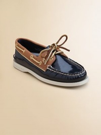 Plush leather upper in a two-tone design adds a modern spin to this lace-up, leather-trimmed basic.Rawhide lace-upPatent leather upperRubber solePadded insoleImported Please note: Number of grommets may vary depending on size ordered. Plush leather upper in a two-tone design adds a modern spin to this lace-up, leather-trimmed basic.Rawhide lace-upPatent leather upperRubber solePadded insoleImported Please note: Number of grommets may vary depending on size ordered.