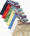 Warm up his wardrobe with a pair of Tommy Hilfiger flat-front slim-fit shorts that make it easy to get styled for summer fast.