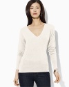 Warmth and style come together in harmony in a luxuriously soft V-neck rendered in cozy cashmere.