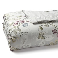 This romantic Waterford comforter boasts a multicolor floral pattern in cool shades of plum, green, slate blue and soft yellow on a silver ground. Resplendent details such as a silver twist cord and luminous silver sprig pattern reverse bring heirloom elegance to your bedroom.