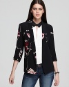 Artistically printed flowers in a mix of neutral and radiant hues enliven this striking French Connection blazer for dressy occasions or denim days.