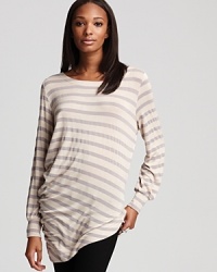 Classic stripes cleverly juxtapose a hypermodern asymmetrical silhouette in this sumptuously slouchy Kain sweater. Classic stripes cleverly juxtapose a hypermodern asymmetrical silhouette in this sumptuously slouchy Kain sweater.