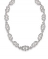 Elevate your look to stunning with this sparkling necklace by Carolee. Features an ornate pattern highlighting dozens of glittering glass stones set in silver tone mixed metal. Approximate length: 16 inches + 2-inch extender.