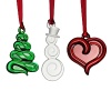 New for 2012! Celebrate the season with this set of three whimsical crystal ornaments from Orrefors including a Christmas tree, a snowman and a bright red heart.