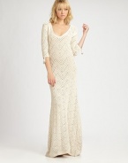 Fabulously long and lean maxi dress of crocheted cotton with beaded fringe detail on the sleeve.V-neckAbout 56 from natural waistCottonDry cleanImported Model shown is 5'9½ (176cm) wearing US size Small 