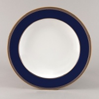 Embellished with intricate garlands, oval links and a fanciful dragon motif, this Wedgwood dinnerware evokes Europe's glorious Renaissance period. Rendered in deep blue and gold to transform any formal meal into a spectacular royal gala.