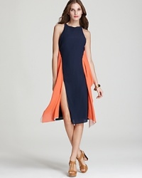 This BCBGMAXAZRIA dress, boasting thigh-high slits, proves that the color-block trend is as elegant as it is striking. This BCBGMAXAZRIA dress, boasting thigh-high slits, proves that the color-block trend is as elegant as it is striking.