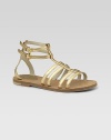 Graceful straps of gleaming gold leather are a modern and elegant look for sandal weather.Leather upperDouble buckle ankle strapsGolden hardwareLeather sole with non-slip rubber finishMade in Italy