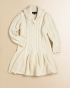 A preppy sweater dress in ultra-soft cabled cotton is accented with a stylish shawl collar and drop waist.Ribbed shawl collarLong sleevesPullover styleDrop-waistCottonMachine washImported