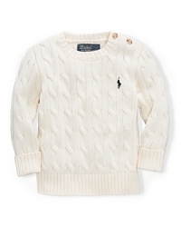 A classic cable crewneck sweater will keep your little one warm with its soft cotton. A classic cable crewneck sweater will keep your little one warm with its soft cotton.