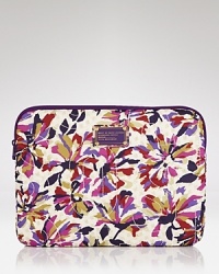 Get your case on point with MARC BY MARC JACOBS. Crafted from durable nylon and splashed in a quirky-cute print, this computer sleeve is an instant laptop upgrade. Get your case on point with MARC BY MARC JACOBS. Crafted from durable nylon and splashed in a quirky-cute print, this computer sleeve is an instant laptop upgrade.