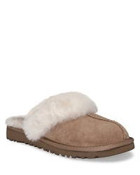 UGG® Australia cozy slippers. Upper is made of suede, lined with sheepskin. Classic EVA lightweight outsole . Insole is genuine sheepskin to naturally wick away moisture and keep feet dry. Mule slippers for cozy comfort while staying inside. UGG® Australia cozy slippers. Upper is made of suede, lined with sheepskin. Classic EVA lightweight outsole . Insole is genuine sheepskin to naturally wick away moisture and keep feet dry. Mule slippers for cozy comfort while staying inside.