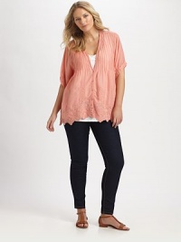 So very pretty, this button-front tunic features stunning embroidery. This just might be your favorite new addition to your wardrobe.V-necklineShort sleevesButton frontEmbroidered trimAbout 31 from shoulder to hemRayonMachine washImported So very pretty, this button-front tunic features stunning embroidery. This just might be your favorite new addition to your wardrobe.V-necklineShort sleevesButton frontEmbroidered trimAbout 31 from shoulder to hemRayonMachine washImported