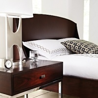 Strikingly simple, Hudson Park's Empire bed draws the eye with rosewood veneers and a generously-scaled headboard with curved side panels. Angled legs and a straight, low footboard complete the timeless, modern look. Strikingly simple, Hudson Park's Empire bed draws the eye with rosewood veneers and a generously-scaled headboard with curved side panels. Angled legs and a straight, low footboard complete the timeless, modern look.
