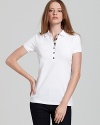 Timeless and seasonless--the makings of a staple. Do basics Brit-style with this classic polo. From Burberry Brit.