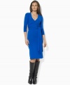 Lauren by Ralph Lauren's sleek jersey dress is crafted in a figure-flattering wrap silhouette and finished with chic three-quarter-length sleeves.
