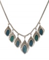 Spread your wings and take on the turquoise trend with this posh, peacock feather necklace from Lucky Brand. Semi-precious turquoise stones elegantly dangle from a charming chain-link collar. Crafted in silver tone mixed metal. Approximate length: 20 inches. Approximate drop: 1-5/8 inches.