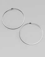 Make a quiet statement in these elegant hoop earrings. Silvertone metalLength, about 2.25Post closureImported 