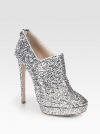 This glitter-coated platform design drips with style, featuring a sky-high heel and metallic leather trim. Self-covered heel, 5¼ (130mm)Covered platform, 1 (25mm)Compares to a 4¼ heel (110mm)Glitter-coated upper with metallic leather trimBack zipLeather lining and solePadded insoleMade in Italy