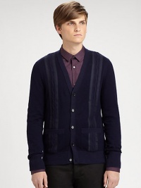 The classic V-neck cardigan updated with textural cable stripes, all in a fine cotton, cashmere & wool knit.V-neckButton frontLong sleevesPatch pocketsRibbed trim33% cotton/31% cashmere/24% woolDry cleanImported The classic V-neck cardigan updated with textural cable stripes, all in a fine cotton, cashmere & wool knit.V-neckButton frontLong sleevesPatch pocketsRibbed trim33% cotton/31% cashmere/24% woolDry cleanImported