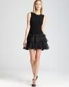 Ruffles bring romance to this Rachel Zoe dress boasting a bow-accented waist and playful tulle skirt for party-perfect style.