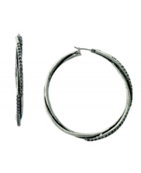 Time to add a little twist to your look. Jessica Simpson puts a modern spin on the traditional hoop earring with a chic, twisted design accented by sparkling topaz-colored crystals. Crafted in silver tone mixed metal. Approximate diameter: 2-1/4 inches. Time to add a little twist to your look. Jessica Simpson puts a modern spin on the traditional hoop earring with a chic, twisted design accented by sparkling topaz-colored crystals. Crafted in silver tone mixed metal. Approximate diameter: 2-1/4 inches.