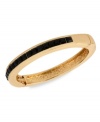 Understated elegance. This bracelet from Kenneth Cole New York is crafted from gold-tone mixed metal, with jet-colored accents giving it a formal feel. Approximate diameter: 2-1/4 inches.