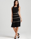 A swing skirt lends a ladylike look to this belted Anne Klein dress, trimmed in metallic stripes.