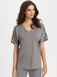 Elegant cross-dyed floral lace adorns the sleeves of this soft modal knit for a feminine touch. V-neckShort sleevesElasticized waistband with self-tie drawstringInseam, about 2965% modal/35% polyesterMachine washImported Elegant cross-dyed floral lace adorns the sleeves of this soft modal knit for a feminine touch. V-neckShort sleevesElasticized waistband with self-tie drawstringInseam, about 2965% modal/35% polyesterMachine washImported