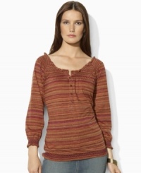 Bohemian inspiration comes to life in Lauren Jeans Co.'s soft cotton jersey top, finished with smocked detailing at the neckline, cuffs and hem. Bohemian inspiration comes to life in Lauren Jeans Co.'s soft cotton jersey top, finished with smocked detailing at the neckline, cuffs and hem.