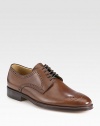 Washed calfskin leather lace-up derby style with signature brogue detail makes a handsome addition to any dress wardrobe.Leather upperLeather liningPadded insoleLeather soleImported