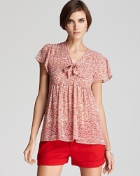 Add feminine appeal to your spring repertoire with this Joie printed top, featuring an empire silhouette and a tie at the neckline. Add feminine appeal to your spring repertoire with this Joie printed top, featuring an empire silhouette and a tie at the neckline.
