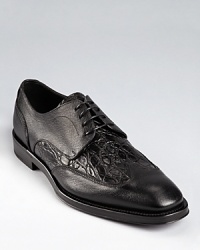 Rendered in true crocodile skin and leather, these authentic wingtips from time-honored Salvatore Ferragamo offer classic refinement and exceptional design. Rendered in true crocodile skin and leather, these authentic wingtips from time-honored Salvatore Ferragamo offer classic refinement and exceptional design.