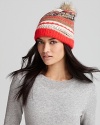 Juicy goes jacquard with this multicolored knit hat, featuring sparkly threads and a faux fur pom-pom.