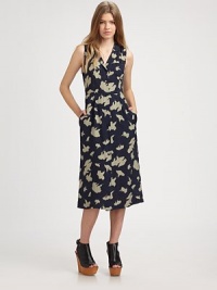 Parisienne-inspired silhouette features a back self tie that cinches the waist, front patch pocket and notched lapels. Notched lapelsFront patch pocketButton frontSleevelessButton frontBeltAbout 29 from natural waist51% rayon/49% silkDry cleanMade in USA of imported fabricModel shown is 5'9½ (176cm) wearing US size 4. Parisienne-inspired silhouette features a back self tie that cinches the waist, front patch pocket and notched lapels. Notched lapelsFront patch pocketButton frontSleevelessButton frontBeltAbout 29 from natural waist51% rayon/49% silkDry cleanMade in USA of imported fabricModel shown is 5'9½ (176cm) wearing US size 4.