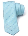 The slim, modern silhouette of this alluring polka dot tie separates it from the old guard. Wrought in exceptional silk for a luxurious addition to your wardrobe, it pairs well with fine dress shirting and more casual looks alike.