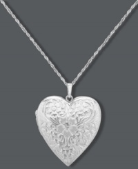 Whatever your heart desires. This intricate pendant offers a stunning engraved surface, sparkling diamond accent and charming locket design. Set in sterling silver. Approximate length: 18 inches. Approximate drop: 1-1/4 inches. Whatever your heart desires. This intricate pendant offers a stunning engraved surface, sparkling diamond accent and charming locket design. Set in sterling silver. Approximate length: 18 inches. Approximate drop: 1-1/4 inches.
