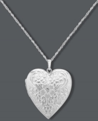 Whatever your heart desires. This intricate pendant offers a stunning engraved surface, sparkling diamond accent and charming locket design. Set in sterling silver. Approximate length: 18 inches. Approximate drop: 1-1/4 inches.