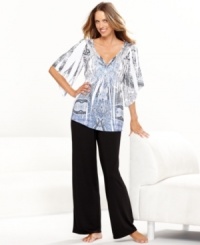 Embrace the beautiful prints of One World's Black Tears pajamas set. The top features a v-neck and smooth satin detailing on the front and neckline, while the roomy pants feature a comfy elastic waistband. Embrace the beautiful prints of One World's Black Tears pajamas set. The top features a v-neck and smooth satin detailing on the front and neckline, while the roomy pants feature a comfy elastic waistband.