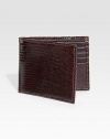 EXCURSIVELY OURS.An elegant menswear standard is crafted in genuine lizard. One bill compartmentEight card slots4½ X 3½Imported