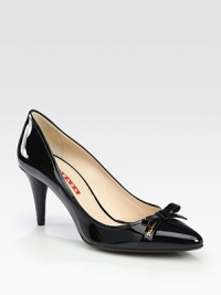 Patent leather pointed toe style with bow and logo detail. Self-covered heel, 3 (75mm)Patent leather upperLeather liningRubber solePadded insoleImportedOUR FIT MODEL RECOMMENDS ordering true size. Patent leather pointed toe style with bow and logo detail. Self-covered heel, 3 (75mm)Patent leather upperLeather liningRubber solePadded insoleImportedOUR FIT MODEL RECOMMENDS ordering true size.
