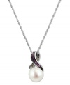 Stand out, in style. This sterling silver necklace, with a cultured freshwater pearl (8-8-1/2 mm) pendant and pink sapphire and diamond accents, proves to be quite captivating. Approximate length: 18 inches. Approximate drop: 5/8 inch.