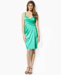A timeless taffeta cocktail dress is accented with elegant accordion pleats as an intricate addition to a classic evening silhouette, from Lauren by Ralph Lauren. A timeless taffeta cocktail dress is accented with elegant accordion pleats as an intricate addition to a classic evening silhouette, from Lauren by Ralph Lauren.