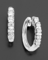 An exquisite row of channel-set, round-cut diamonds (1/2 ct. t.w.) grace 14k white gold for a truly stunning look.