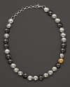 Crafted in hammered dark silver, white silver and 24 Kt. yellow gold, this Lentil necklace from Gurhan brings an earthy elegance to your everyday look.