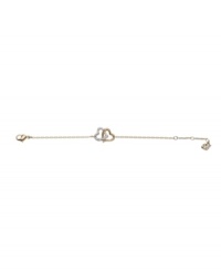 Show your romantic side with Swarovski's interlocking heart bracelet. Made in gold tone mixed metal with crystal embellishments. Approximate length: 7 inches. Show your romantic side with Swarovski's interlocking heart bracelet. Made in gold tone mixed metal with crystal embellishments. Approximate length: 7 inches.